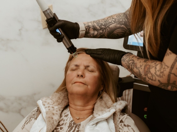 Woman receiving TotalSkin Solution